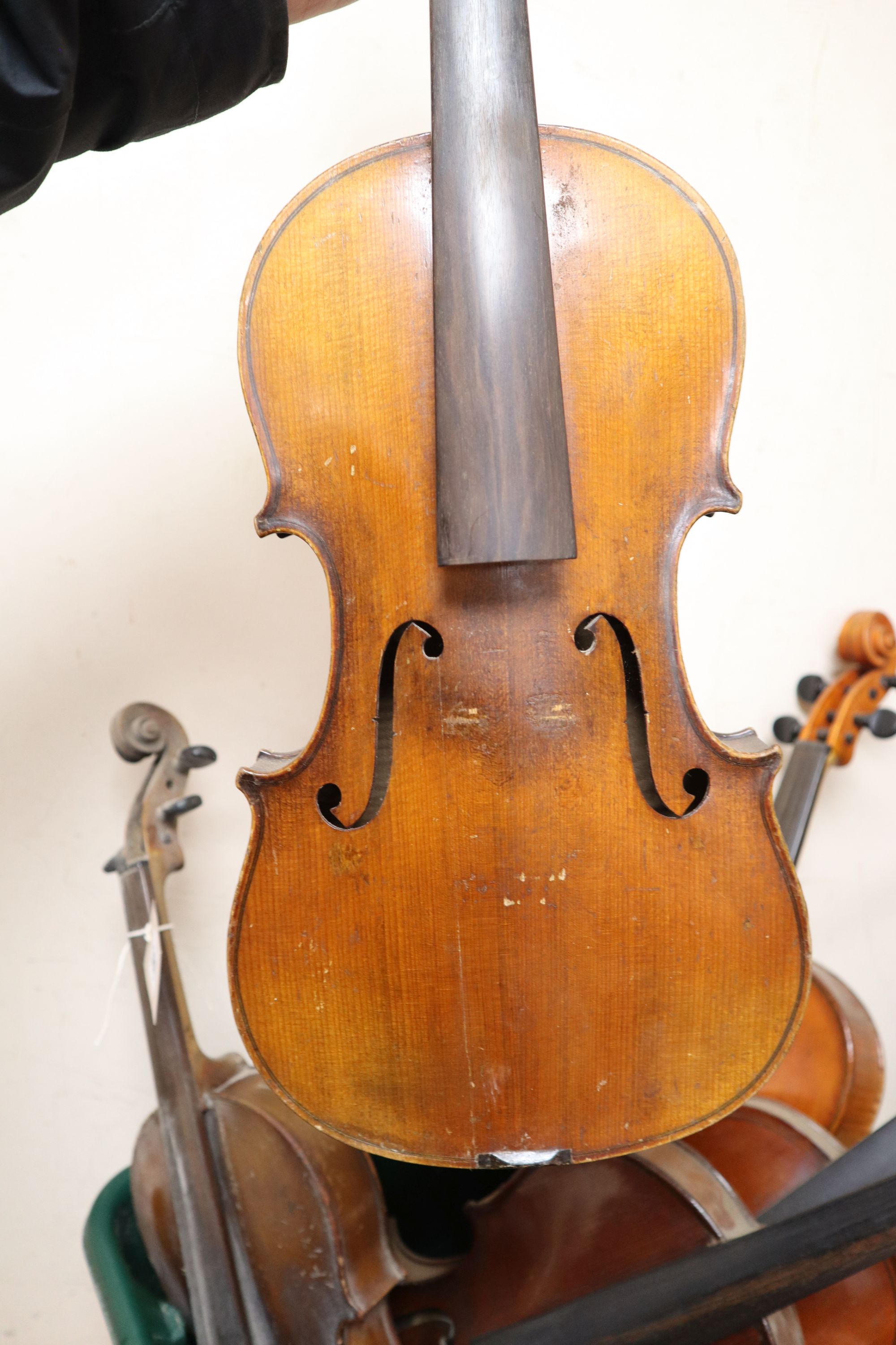 A group of five early 20th century violins